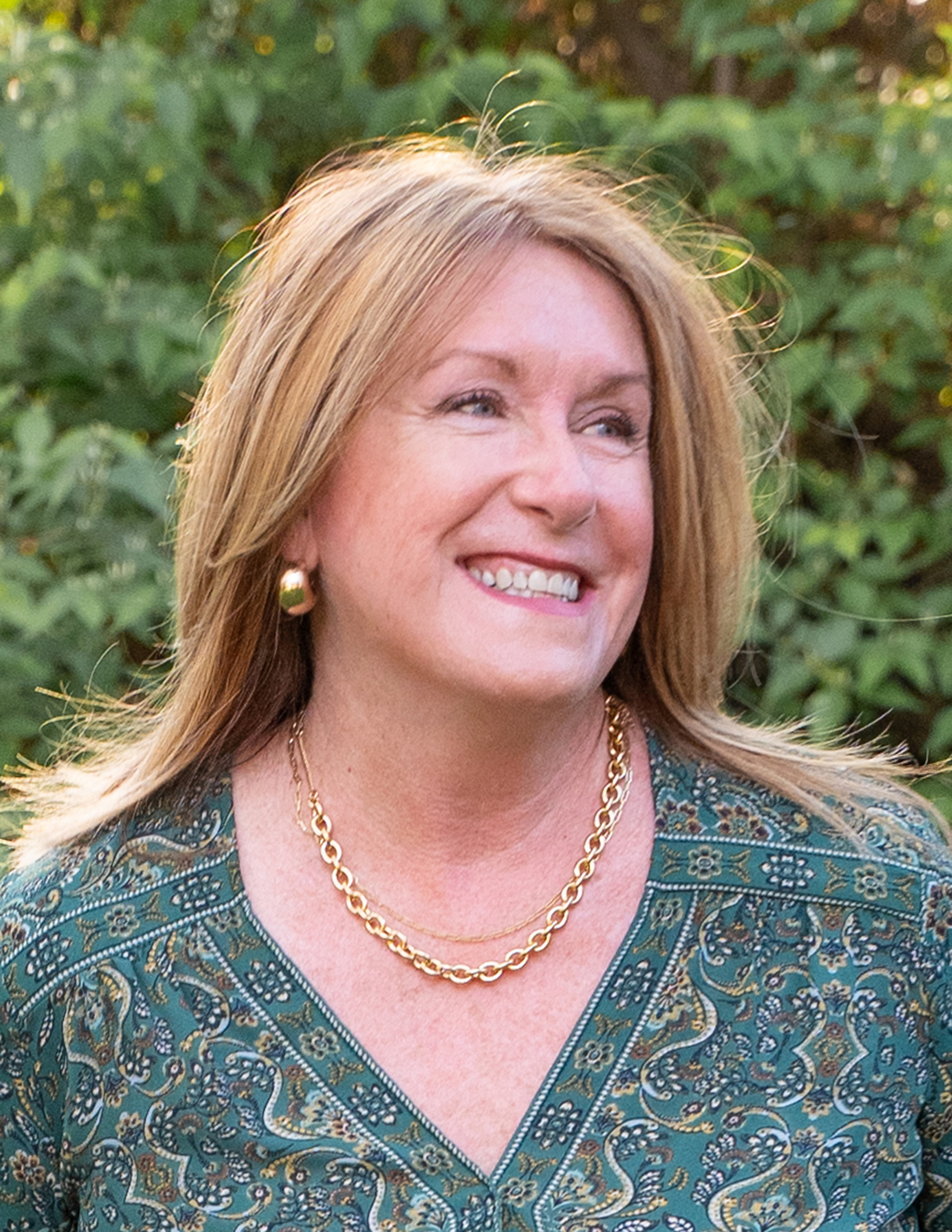 Dr. Carolyn Lorente smiling outdoors.